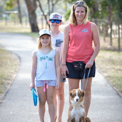 Family with dog on lead