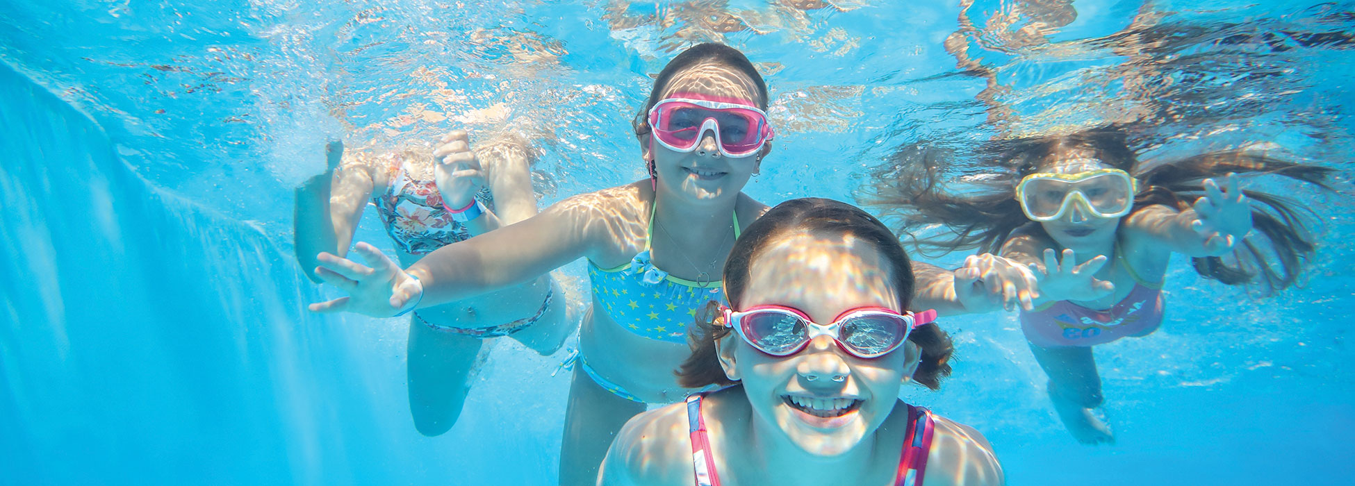 Pool swim girl shutterstock 2465618481